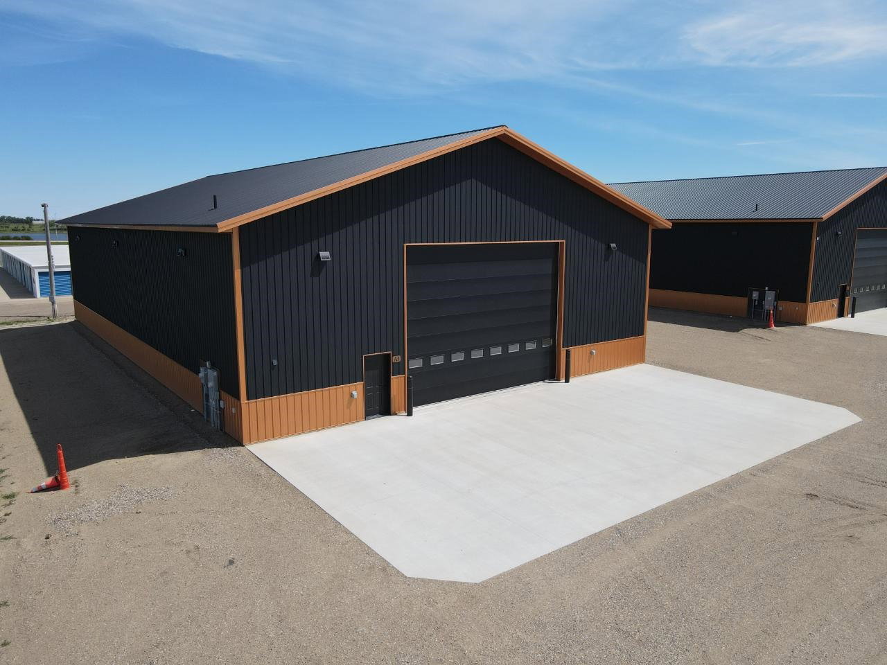 Unit A1 exterior with the 24' x 18' overhead door and poured concrete approach