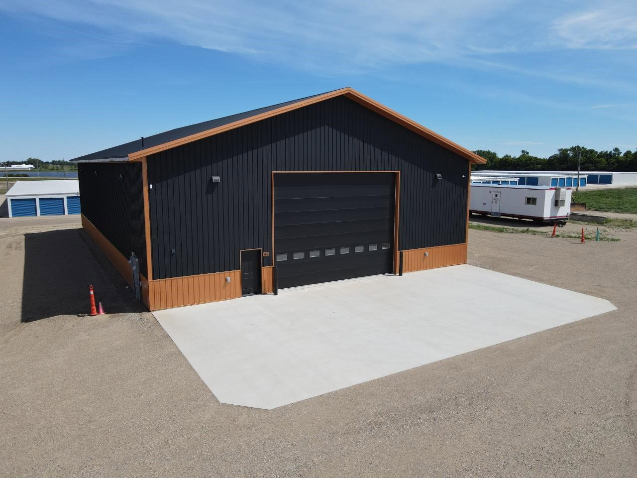 Unit A2 exterior with the 24' x 18' overhead door and concrete approach