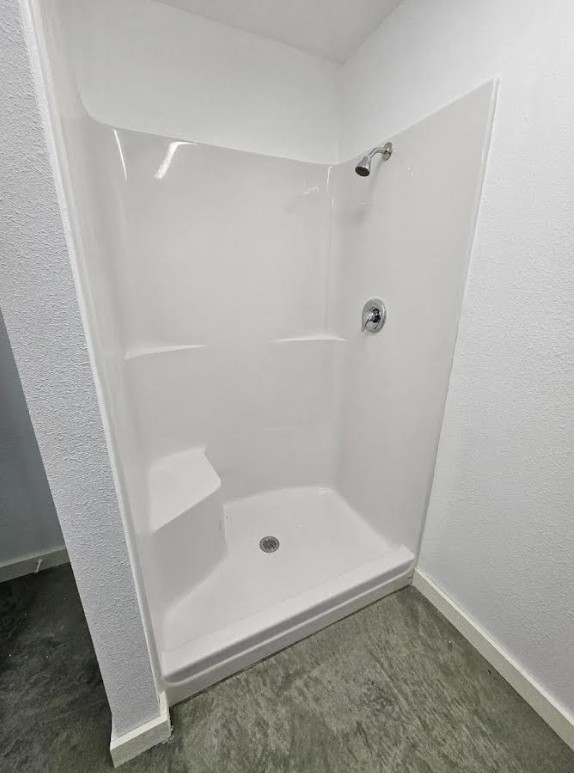 Unit C3 — finished bathroom with a tiled shower